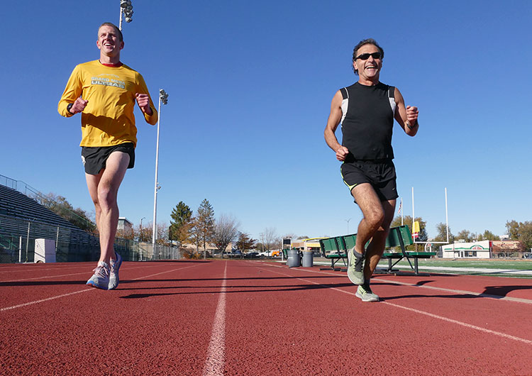 Runners of the Mesa Monument Striders running on the track of Stoker Stadium in Grand Junction, Colorado