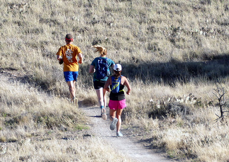 Runners of the Mesa Monument Striders running on the trails at Lunch Loop in Grand Junction, Colorado